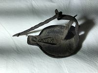 Top view of lamp showing reservoir and spout