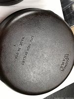 Bottom of Wagner #10 cast iron skillet showing brand and measurements