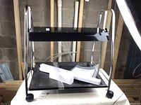 Full view of the assembled Floralight Indoor Light Garden unit showing the metal frame with lighting fixture and plant trays.