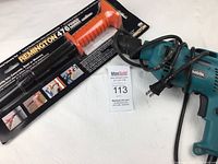 Remington 476 concrete nail driver in original package alongside Makita hammer drill with power cord, displayed on white background with MaxSold auction tag