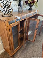 Front and angled view showing three glass paneled doors and stone tile accent strip on top edge