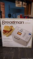 Front of Breadman Professional Breadmaker box showing product image and key features.