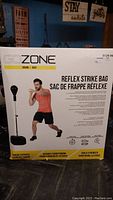 Photo of the boxed Gozone Reflex Strike Bag with model demonstrating usage and product details on packaging.