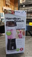 Box front showing blender image and features