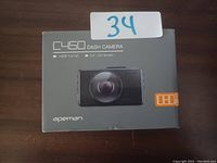 Front of the boxed Apeman C450 dash camera showing model, features and brand.