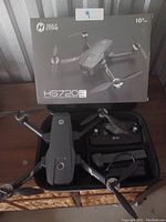 Holy Stone HS720E drone laid out in carrying case with remote controller and original retail box