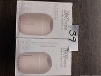 Two boxed bottle humidifiers shown from front and side, featuring product image and some Chinese text plus English words 'Bottle Humidifier'.
