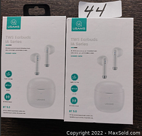 Front view of two USAMS TWS IA Series earbuds packaging showing earbuds and charging case images