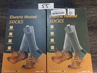 Front view of two boxes of Electric Heated Socks showing grey socks and heating features.
