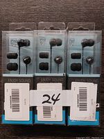 Photo showing three sealed packages of Sennheiser CX 175 iPod earbuds, each with an additional set of silicone ear tips.