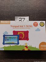 Front view of Reezo Tronpad Kid 7-TK701 tablet box with colored kid-friendly cases and product branding visible.