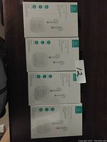 Four boxed sets of TWS wireless earbuds, white, unopened.