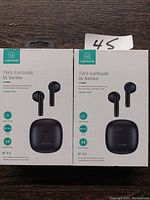 Front view of two USAMS TWS Earbuds IA Series boxes showing earbuds and charging case illustrations, featuring Bluetooth 5.0 compatibility.