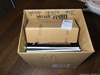Box containing the Judaica books about Ethiopian Jews, partially visible inside a large cardboard box.