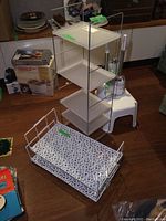 White 4-shelf metal and plastic organizer and white metal wire floral tray