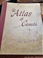 Front cover of the 1957 Atlas of Canada showing the title and publishing department.