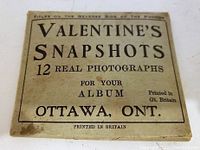 Close-up of package titled 'Valentine's Snapshots 12 Real Photographs for Your Album Ottawa, Ont.' printed in Great Britain
