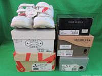Stack of shoe boxes showing brands and sizes for six pairs of shoes including New Balance, Anne Klein II, Privo, Merrell, Steve Madden, and J ROAM.