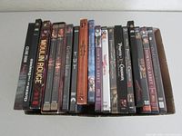 18 DVD cases mostly with multiple DVDs inside, showing titles and spines in a single row.