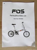Instruction manual showing model SP34856 folding bicycle image and brand FDS.