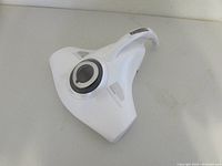 Top view showing the white Raycop RS2 allergen vacuum with ergonomic handle and sleek triangular design.