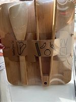 New bamboo serving set, rectangular tray with two utensils wrapped in paper packaging