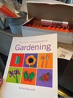 The Hamlyn Encyclopedia of Gardening book with colorful cover depicting gardening gloves, tools, flowers