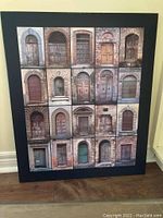 Framed print with collage of 20 vintage doors displayed on floor.