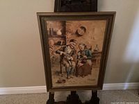 Full framed painting leaning on easel against wall