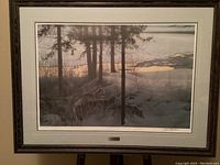 Full view of framed print showing wolves in snowy forest at dusk, multi-layer mat, wood frame and nameplate