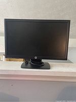 Front view of HP ProDisplay P201m monitor showing screen and stand