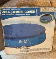 Photo of Intex pool debris cover box showing size, brand, and design information.