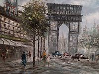 Close-up of the framed artwork showing street scene with trees, arch, people, and cars in muted color tones.