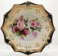 Front view of the RS Prussia berry bowl showing the scalloped edges, gold detailing, teal accents, and central pink rose floral design.