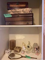 Three stacked jewelry boxes with a tag showing 13x9.5 size on the top box