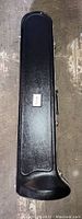 Closed black hard case for the trombone with textured exterior and Blessing USA logo plaque.