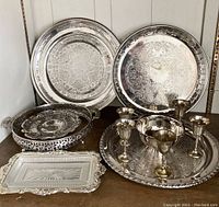 Overview of all 11 pieces showing large trays, goblets, and openwork bowls