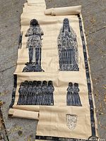 Full view of very large antique rubbing on paper showing multiple medieval figures and coat of arms in black ink.
