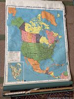 Full view of the map showing the entirety of North America with countries and states/provinces colored distinctly, mounted on roller.