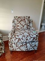 Front view of one chair with part of second chair visible at left