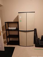 Front view of beige WorkForce cabinet and black shelving unit side by side