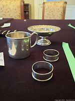 Overview of all four sterling silver pieces on display