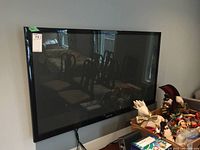 Front view of mounted Samsung TV with reflective screen