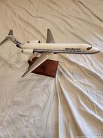 Full side view of the Boeing 717 model airplane on display stand showing overall condition and markings