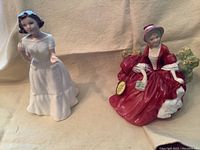 Photo showing both Lydia HN1908 and Welcome Royal Doulton figurines side by side