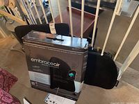 Embraceair deluxe backrest boxed and three black backrests behind box