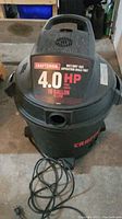 Front view of Craftsman wet/dry vacuum showing 4.0 HP 10 gallon label and power cord.