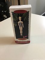 Front of the original Hallmark box showing the Barbie figure ornament image and branding.