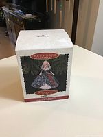 Box front showing Keepsake ornament branding and image of Barbie ornament