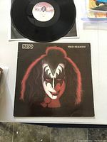 Vinyl LP and album cover with Gene Simmons makeup portrait front cover.